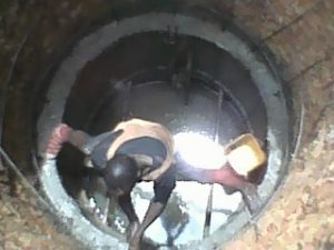 Contractor Coming Out of Well Pit